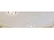 Close-up of a textured ceiling with two flush mount lights and crown molding at 8934 Pinyon Ct, Indianapolis, IN 46260