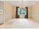 Dining room featuring plush carpet, neutral paint and a decorative chandelier at 8934 Pinyon Ct, Indianapolis, IN 46260
