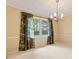 Dining area with plush carpet, neutral paint and a window view of backyard at 8934 Pinyon Ct, Indianapolis, IN 46260
