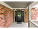 Covered porch featuring a traditional front door with sidelights and a lantern at 8934 Pinyon Ct, Indianapolis, IN 46260