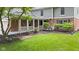 Charming front porch featuring brick accents, landscaping, and a covered entryway at 8934 Pinyon Ct, Indianapolis, IN 46260