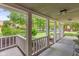 Open porch with white railings and lush green landscaping at 8934 Pinyon Ct, Indianapolis, IN 46260