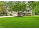 Beautiful two-story home featuring a brick facade, attached garage, and a spacious green lawn at 8934 Pinyon Ct, Indianapolis, IN 46260