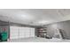 Two car garage with gray painted walls, overhead door and storage shelves at 8934 Pinyon Ct, Indianapolis, IN 46260