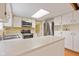 This well-lit kitchen has stainless steel appliances, recessed lighting, and ample cabinet space at 8934 Pinyon Ct, Indianapolis, IN 46260