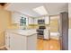 Bright kitchen features stainless steel appliances, light countertops, and a window over the sink at 8934 Pinyon Ct, Indianapolis, IN 46260