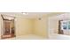 Bright room with plush carpet, light yellow walls, and view into dining room and hallway at 8934 Pinyon Ct, Indianapolis, IN 46260