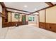 Comfortable living room with wood trim and a view into the adjacent breakfast room at 8934 Pinyon Ct, Indianapolis, IN 46260