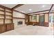 Living room showcasing a fireplace, built-in shelving, wood trim, and access to outdoor space at 8934 Pinyon Ct, Indianapolis, IN 46260