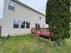 Backyard with a wood deck that has access via a sliding glass door at 8939 Newchurch Blvd, Indianapolis, IN 46231