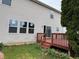 Backyard with a wood deck that has access via a sliding glass door at 8939 Newchurch Blvd, Indianapolis, IN 46231