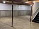 Unfinished basement with concrete floor and support beams, ready to be customized at 8939 Newchurch Blvd, Indianapolis, IN 46231