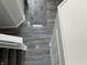 Carpeted staircase and hall with luxury vinyl plank flooring at 8939 Newchurch Blvd, Indianapolis, IN 46231