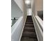 Carpeted stairs with white railing at 8939 Newchurch Blvd, Indianapolis, IN 46231
