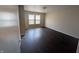 Cozy bedroom featuring hardwood floors, natural light, and neutral paint at 901 Westpointe Dr, Shelbyville, IN 46176