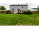 Backyard featuring a wood deck, green lawn, and the exterior of the home at 9206 Huntleigh Cir, Plainfield, IN 46168