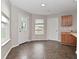 Breakfast Nook with ample natural light, light grey walls, and vinyl flooring at 9206 Huntleigh Cir, Plainfield, IN 46168