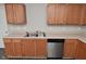 A view of the kitchen sink and stainless steel dishwasher at 9206 Huntleigh Cir, Plainfield, IN 46168