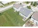 Aerial view of a home's large, green backyard with a garden, patio area, and mature trees at 935 Northwich Ave, Westfield, IN 46074