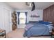 Neutral bedroom featuring a large bed, shelving with plants, and a modern painting at 935 Northwich Ave, Westfield, IN 46074