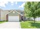 Charming two-story home with brick and shingle exterior, landscaped yard, and attached two-car garage at 935 Northwich Ave, Westfield, IN 46074