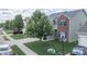 Two-story home with a well-manicured front yard and a basketball hoop over the garage at 935 Northwich Ave, Westfield, IN 46074