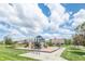 The community playground features a variety of engaging play structures, picnic tables, and lush greenery for Gathering fun at 935 Northwich Ave, Westfield, IN 46074