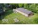 Aerial view of the home with a well-manicured lawn and patio area at 9390 N State Road 39, Lizton, IN 46149