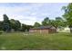 Large backyard with trees and garden, features a fenced in area at 9390 N State Road 39, Lizton, IN 46149