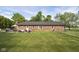 View of backyard with patio and brick exterior of home at 9390 N State Road 39, Lizton, IN 46149