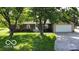 Charming ranch home featuring a well-manicured lawn and an attached garage at 9390 N State Road 39, Lizton, IN 46149
