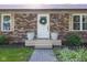 Close up of front door showing brickwork, sidelight windows and decorative wreath at 9390 N State Road 39, Lizton, IN 46149