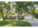 Charming brick ranch home with mature trees, well-manicured lawn and two car garage at 9390 N State Road 39, Lizton, IN 46149