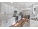 Spacious kitchen with stainless appliances, marble counters, white cabinets and wood-look flooring at 9390 N State Road 39, Lizton, IN 46149