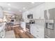 Bright kitchen featuring stainless steel appliances, marble countertops, and a view to the living room at 9390 N State Road 39, Lizton, IN 46149