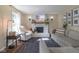 Inviting living room with a charming brick fireplace, natural light, and plush seating at 9390 N State Road 39, Lizton, IN 46149