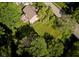 Aerial view of home highlighting its large, well-manicured yard, trees, and proximity to the road at 9705 Valley Springs Blvd, Fishers, IN 46037