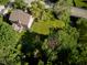 Aerial view of the home showcasing the backyard, mature trees and surrounding landscape at 9705 Valley Springs Blvd, Fishers, IN 46037
