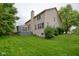 Well-maintained home featuring a deck, a cozy chimney, and a lush green backyard at 9705 Valley Springs Blvd, Fishers, IN 46037