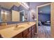 Primary bath showcasing a double vanity, and access to a shower-tub combo at 9705 Valley Springs Blvd, Fishers, IN 46037