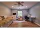 Bedroom with wood floors, window, ceiling fan, and lots of natural light at 9705 Valley Springs Blvd, Fishers, IN 46037