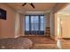 This inviting bedroom has a ceiling fan, wood floors, and a door leading to the outside at 9705 Valley Springs Blvd, Fishers, IN 46037