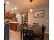 Dining Room showcasing a dark wood dining table and chairs illuminated by modern pendant lighting at 9705 Valley Springs Blvd, Fishers, IN 46037