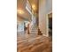 Spacious foyer featuring wood-look floors, a staircase, and an open floor plan at 9705 Valley Springs Blvd, Fishers, IN 46037