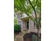 Inviting front exterior with covered porch, manicured lawn, and beautiful landscaping at 9705 Valley Springs Blvd, Fishers, IN 46037