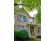 Charming brick home with covered porch, inviting entrance, and green shutters at 9705 Valley Springs Blvd, Fishers, IN 46037