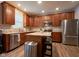 Updated kitchen with stainless appliances, granite countertops, and a central island at 9705 Valley Springs Blvd, Fishers, IN 46037