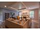 Bright living room featuring a fireplace, a cozy sectional, and recessed lighting at 9705 Valley Springs Blvd, Fishers, IN 46037