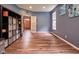 The bright living room features wood floors and is decorated with stylish artwork and storage containers at 9705 Valley Springs Blvd, Fishers, IN 46037