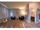 Inviting living room with hardwood floors, neutral walls, and comfortable seating at 9705 Valley Springs Blvd, Fishers, IN 46037